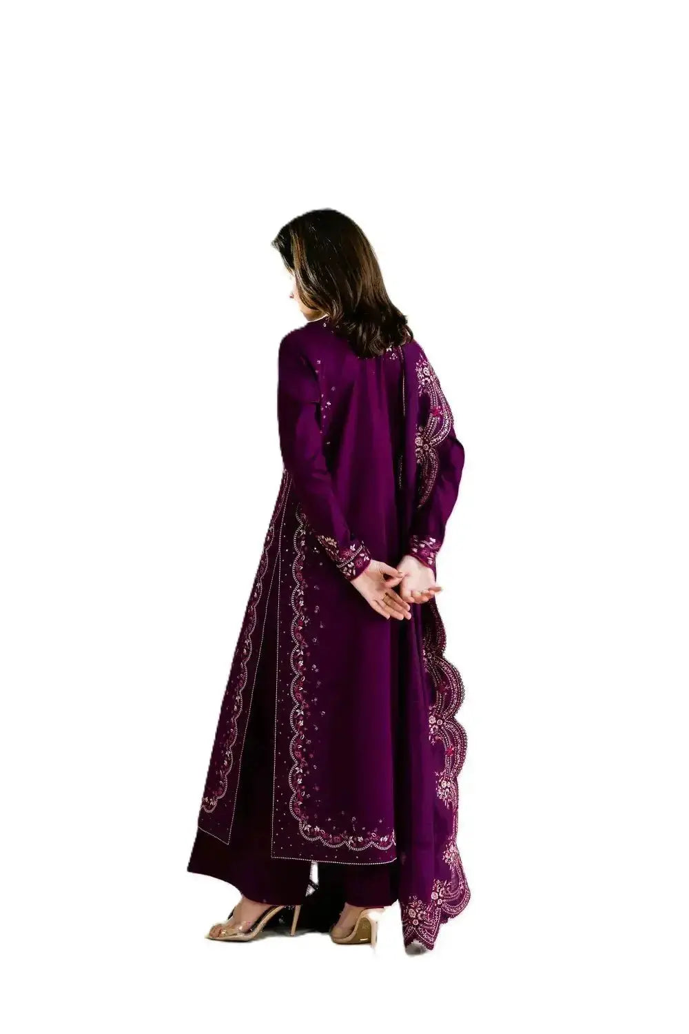 Woman wearing a purple embroidered traditional outfit on a white background