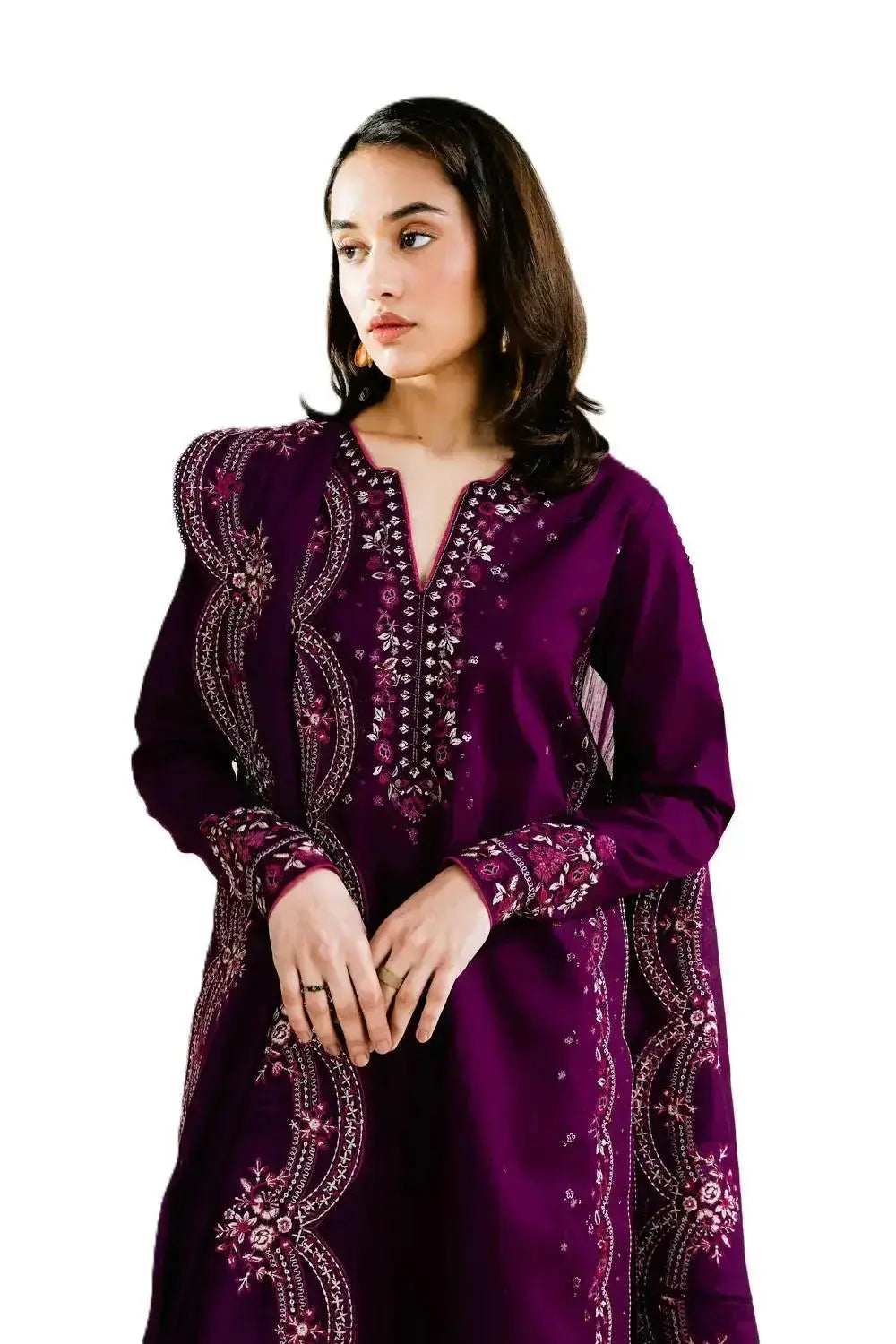 Woman wearing a purple embroidered dress on a white background