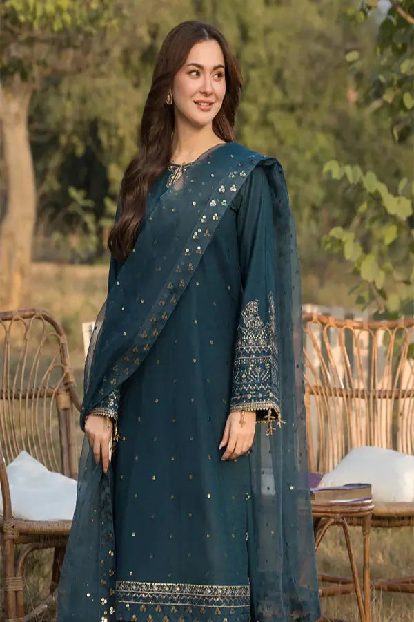 woman wearing 3pc embroidered lawn suit with sequins dupatta